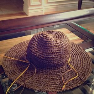 Brown floppy straw hat