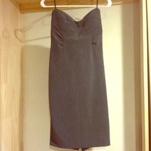 Cute strapless dress .