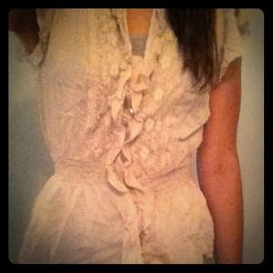 Cream colored ruffled blouse