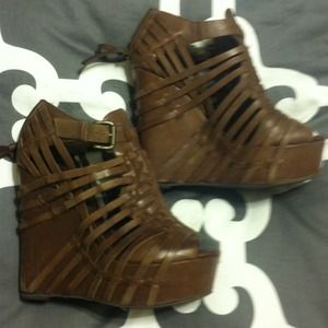 Brown strappy wedge heel.
