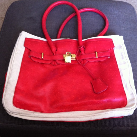 Red tote with gold lock/key hardware
