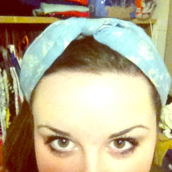 Baby blue headband with white designs
