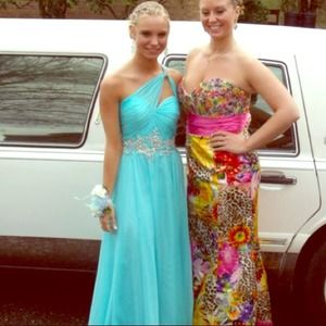 Teal goddess style formal dress.