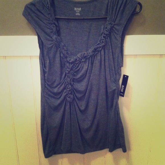 RESERVED!! Cute top! Fit is snug and flattering!