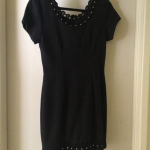 Black dress with scalloped detailing, soft fabric
