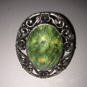 Adjustable, peacock ring.