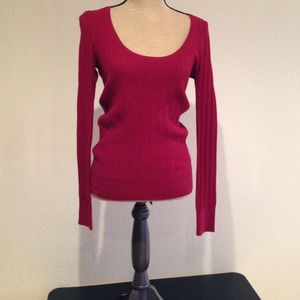 Red ribbed sweater.