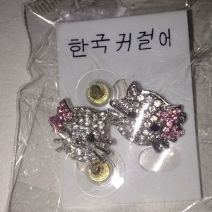 Brand new, fake Hello Kitty ear rings.