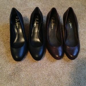 2 pairs of Cole Haans 1 brown and 1 black.