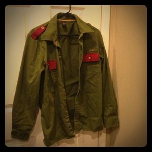 Green shirt/jacket style.