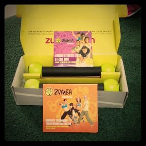 Zumba kit~DVDs and sticks!! Only used 1 time!!