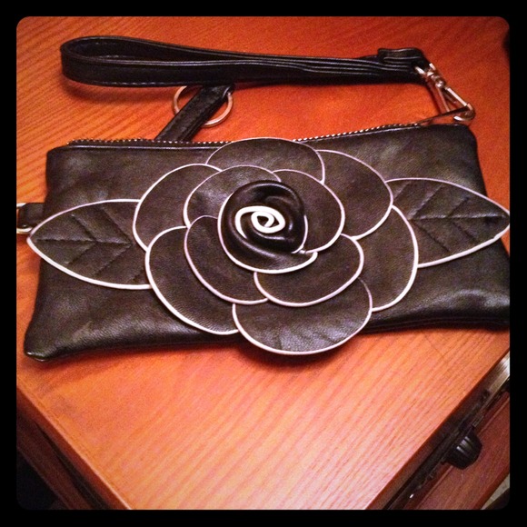 Black clutch with flower accent