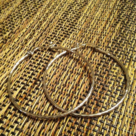 Silver hoops earrings.