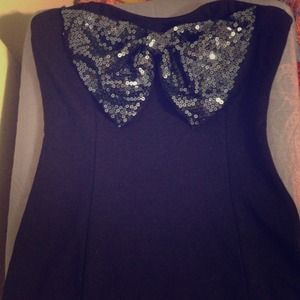 Navy party dress with sequin bow