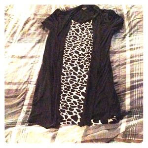 A leopard print dress with black over lay..