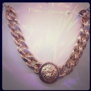 Gold lion crest necklace