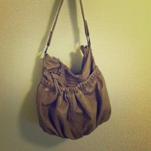Tan purse with two outside pouches