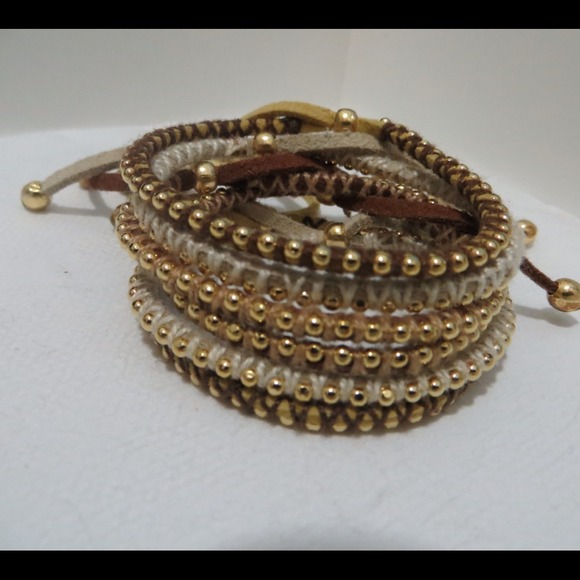 6 little gold chain bracelets.