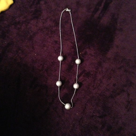 Silver toned necklace with glitter balls