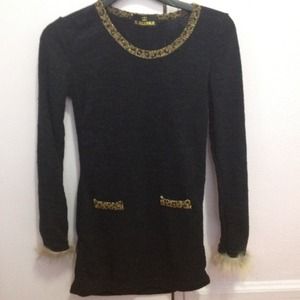 Tunic with furry sleeves