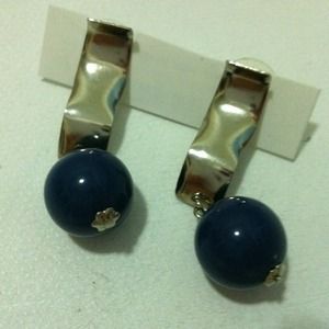 Silver earrings.