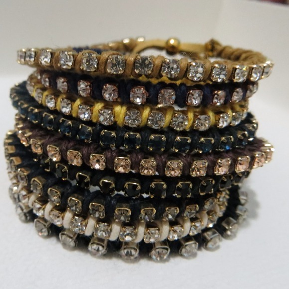 Rhinestone arm party bracelets.