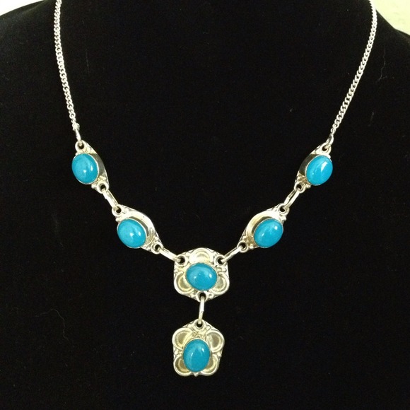 Silver necklace with beautiful light blue stones.
