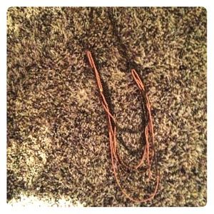 pink and gold necklace.