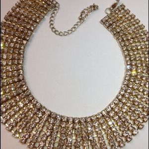 Shiny golden necklace. Many bling bling crystals