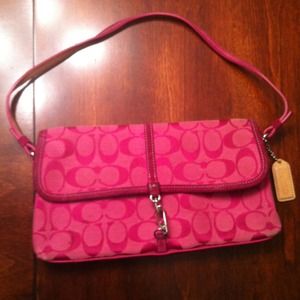 Pink coach clutch with strap