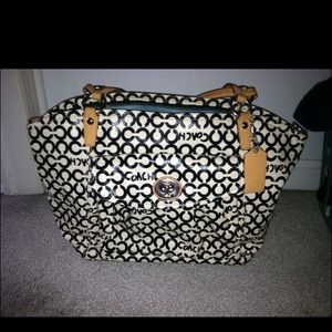 $68 Coach covered canvas cross body and hand bag.