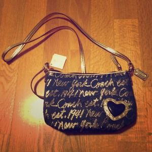 Coach signature script navy and gold hobo handbag
