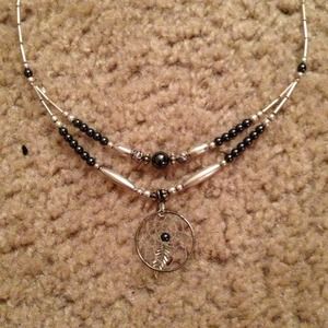Silver and metallic black dream catcher necklace