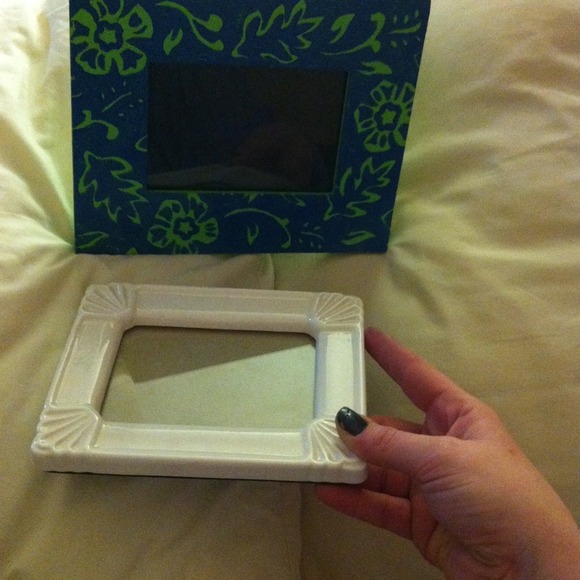 White ceramic frame. Thick wooden frame.