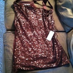 Jennifer Lopez brown asymmetrical shirt