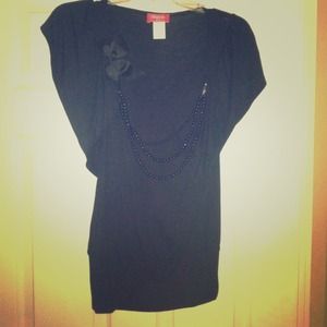 Black top with black  bow and pearls attached