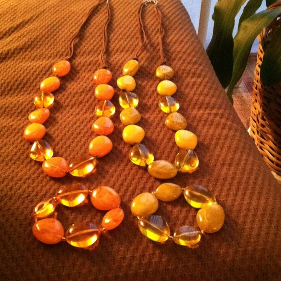 Two necklaces and two matching bracelets