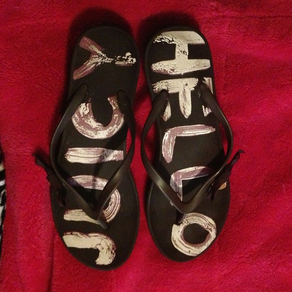 Used pair of juicy couture flip flops