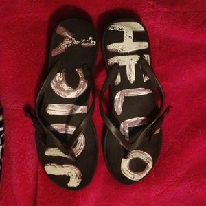 Used pair of juicy couture flip flops