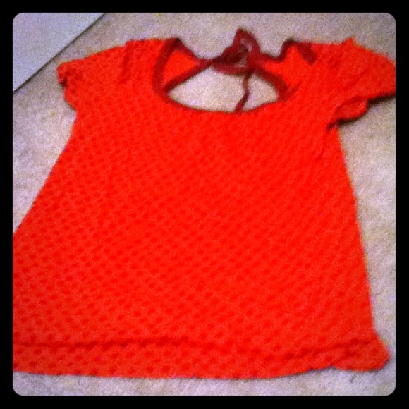 Peach shirt with red poka dots