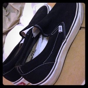 Used Vans black slip ons. Women size 10, men 8.5.
