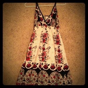 ↗White dress with black red and dark pink flowers