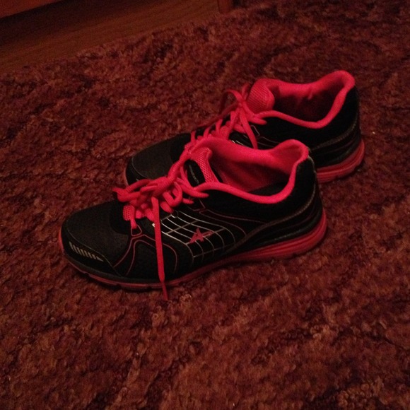 Pink and black running shoes
