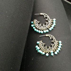 Turquoise hoop earrings.