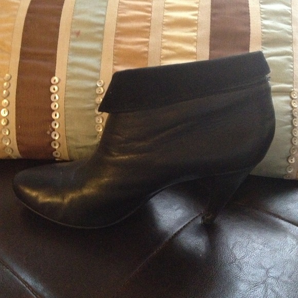 Slightly worn Coach boots some Scrapes on  heels.