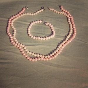2 pearl necklaces and a pearl bracelet