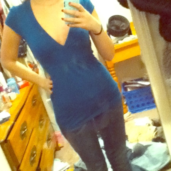 Stretchy. Dark turquoise nice shirt.