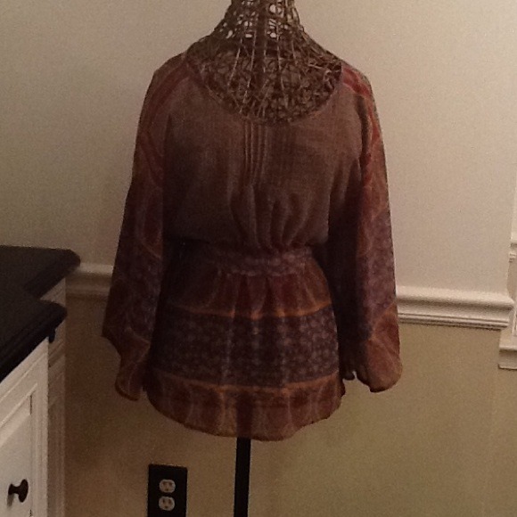 Sold.  Multi color top with angel sleeves