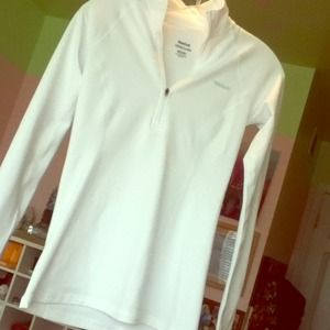 white reebok athletic long sleeve 1/4 zip top.