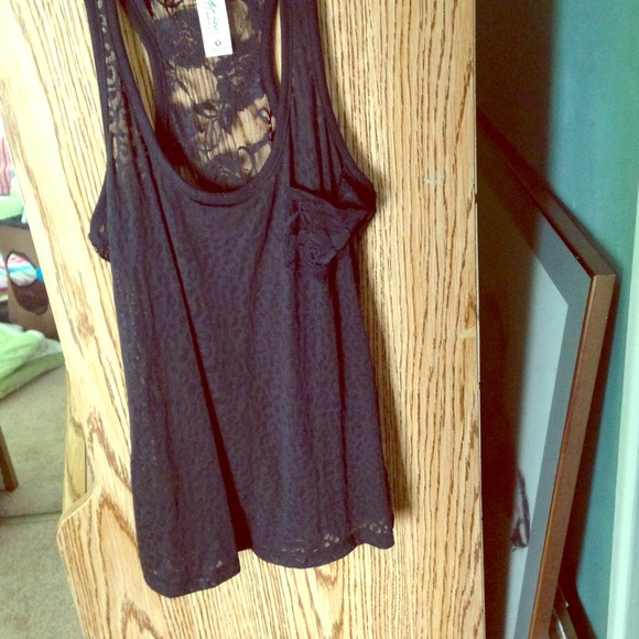 Black sheer lace top with front lace pocket detail